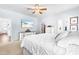 Spacious bedroom with a walk-in closet and a decorative ceiling fan at 27 Ashley Woods Ct, Clayton, NC 27527