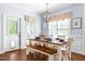 Dining area with seating for six, wood floors, and lots of natural light at 27 Ashley Woods Ct, Clayton, NC 27527