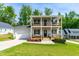 Charming two-story home featuring double balconies and a well-manicured front yard at 27 Ashley Woods Ct, Clayton, NC 27527