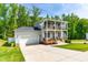 Attractive two-story home with a two car garage, double porches and lush landscaping at 27 Ashley Woods Ct, Clayton, NC 27527