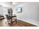 Home office setup with desk, chair, bookcase, and mounted TV, perfect for remote work or study at 27 Ashley Woods Ct, Clayton, NC 27527