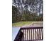 Backyard view from the deck showing a wooded lot at 282 W Thicket Dr, Angier, NC 27501