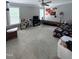 Spacious bedroom with neutral carpet, a ceiling fan, and two windows at 282 W Thicket Dr, Angier, NC 27501