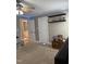 Bedroom featuring neutral carpet, a ceiling fan, and a closet at 282 W Thicket Dr, Angier, NC 27501