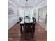 Elegant dining room featuring a dark wood table and a large window at 282 W Thicket Dr, Angier, NC 27501