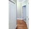 Hallway with hardwood floors and multiple doors leading to other rooms at 282 W Thicket Dr, Angier, NC 27501