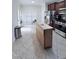Bright kitchen with a movable wooden island and modern appliances at 282 W Thicket Dr, Angier, NC 27501