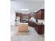 Well-equipped kitchen featuring dark cabinets and movable wooden island at 282 W Thicket Dr, Angier, NC 27501