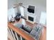 Open concept living room with hardwood floors, fireplace, and a ceiling fan at 282 W Thicket Dr, Angier, NC 27501