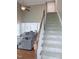 View of living room and stairway to second floor at 282 W Thicket Dr, Angier, NC 27501