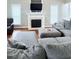 Inviting living room with plush gray sofas and fireplace at 282 W Thicket Dr, Angier, NC 27501