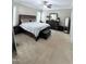 Spacious main bedroom with neutral carpeting, furnishings, and good natural light from two windows at 282 W Thicket Dr, Angier, NC 27501
