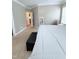 Large carpeted main bedroom features a comfortable bed and an entryway to other rooms at 282 W Thicket Dr, Angier, NC 27501