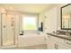 Elegant bathroom featuring walk-in shower, soaking tub, vanity, and ceramic tile floor at 3017 Dog Rose Dr # 169, Durham, NC 27703