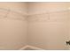 Empty walk-in closet with white wire shelving and neutral paint at 3017 Dog Rose Dr # 169, Durham, NC 27703