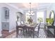 Elegant dining room featuring coffered ceilings, stylish furniture, and natural light from the windows at 3017 Dog Rose Dr # 169, Durham, NC 27703
