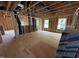 Spacious unfinished home with exposed beams and stud framing, awaiting finishing touches at 3017 Dog Rose Dr # 169, Durham, NC 27703