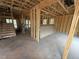 Unfinished home interior showing exposed framing and stairs, ready for customization at 3017 Dog Rose Dr # 169, Durham, NC 27703