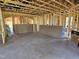 View of a framed living room under construction with exposed studs and materials at 3017 Dog Rose Dr # 169, Durham, NC 27703