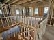 View of a staircase under construction with exposed framing and open floor plan at 3017 Dog Rose Dr # 169, Durham, NC 27703