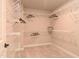 Spacious walk-in closet featuring white wire shelving and neutral carpeting throughout, providing ample storage at 3017 Dog Rose Dr # 169, Durham, NC 27703