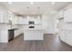 Bright kitchen with white cabinetry, stainless steel appliances, and a central island at 33 Celtic Ln, Lillington, NC 27546