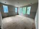 Unfinished bedroom with multiple windows and natural light at 3324 Founding Place, Raleigh, NC 27612