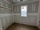 Walk-in closet offering built-in shelving, awaiting customization for optimal storage solutions at 3324 Founding Place, Raleigh, NC 27612