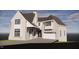 Rendering of a new construction home featuring brick, white siding, a covered porch, and a two-car garage at 3324 Founding Place, Raleigh, NC 27612