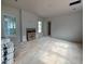 Unfinished room featuring fireplace and windows providing natural light at 3324 Founding Place, Raleigh, NC 27612