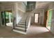 Elegant staircase design showcasing modern black metal railings, complemented by light wood treads at 3324 Founding Place, Raleigh, NC 27612
