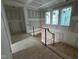 Unfinished stairwell featuring temporary railings and many windows at 3324 Founding Place, Raleigh, NC 27612