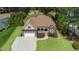 Aerial view of the home showing the lawn and surrounding mature trees at 3612 Griffice Mill Rd, Raleigh, NC 27610