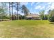 Expansive backyard featuring mature trees and well-manicured lawn at 3612 Griffice Mill Rd, Raleigh, NC 27610