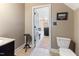 Bathroom with a decorative toilet, a black accent table, and a granite vanity at 3612 Griffice Mill Rd, Raleigh, NC 27610