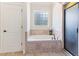 Bathroom features a drop in tub with tile surround and a separate shower at 3612 Griffice Mill Rd, Raleigh, NC 27610