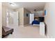 Spacious bedroom features neutral carpet, colorful wall decor, and a blue bedspread at 3612 Griffice Mill Rd, Raleigh, NC 27610