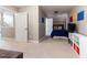 Large bedroom has carpet, beige walls and a blue comforter on the bed at 3612 Griffice Mill Rd, Raleigh, NC 27610