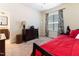 Bedroom featuring carpet, a window, a bed, and an en-suite bathroom at 3612 Griffice Mill Rd, Raleigh, NC 27610
