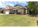 Beautiful home with stone accents, well-manicured lawn, two-car garage, and lush landscaping at 3612 Griffice Mill Rd, Raleigh, NC 27610