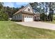 Lovely home with stone accents, well-manicured lawn, two-car garage, and lush landscaping at 3612 Griffice Mill Rd, Raleigh, NC 27610