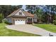 Charming stone and siding home with well-manicured lawn and attached two car garage at 3612 Griffice Mill Rd, Raleigh, NC 27610