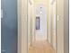 Hallway has carpet floor and arched entryway with views into the bathroom at 3612 Griffice Mill Rd, Raleigh, NC 27610