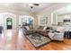 Open-concept living room with hardwood floors and stylish decor, perfect for entertaining and Gathering gatherings at 3612 Griffice Mill Rd, Raleigh, NC 27610