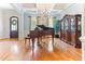 Elegant living room boasts hardwood floors, coffered ceilings, and a dazzling chandelier at 3612 Griffice Mill Rd, Raleigh, NC 27610
