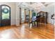 Elegant living room boasts hardwood floors, coffered ceilings, and a dazzling chandelier at 3612 Griffice Mill Rd, Raleigh, NC 27610