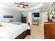 Spacious main bedroom with trey ceiling, with sitting area, TV and open door to main bathroom at 3612 Griffice Mill Rd, Raleigh, NC 27610