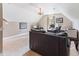 Well-lit, spacious office features a modern desk area, comfortable seating, and unique antler chandelier at 3612 Griffice Mill Rd, Raleigh, NC 27610