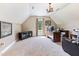 Spacious room as office space features neutral carpet and walls, a chandelier, and a large window at 3612 Griffice Mill Rd, Raleigh, NC 27610