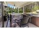 Outdoor kitchen featuring a built-in grill, countertop space, and bar seating with a private backyard at 3612 Griffice Mill Rd, Raleigh, NC 27610